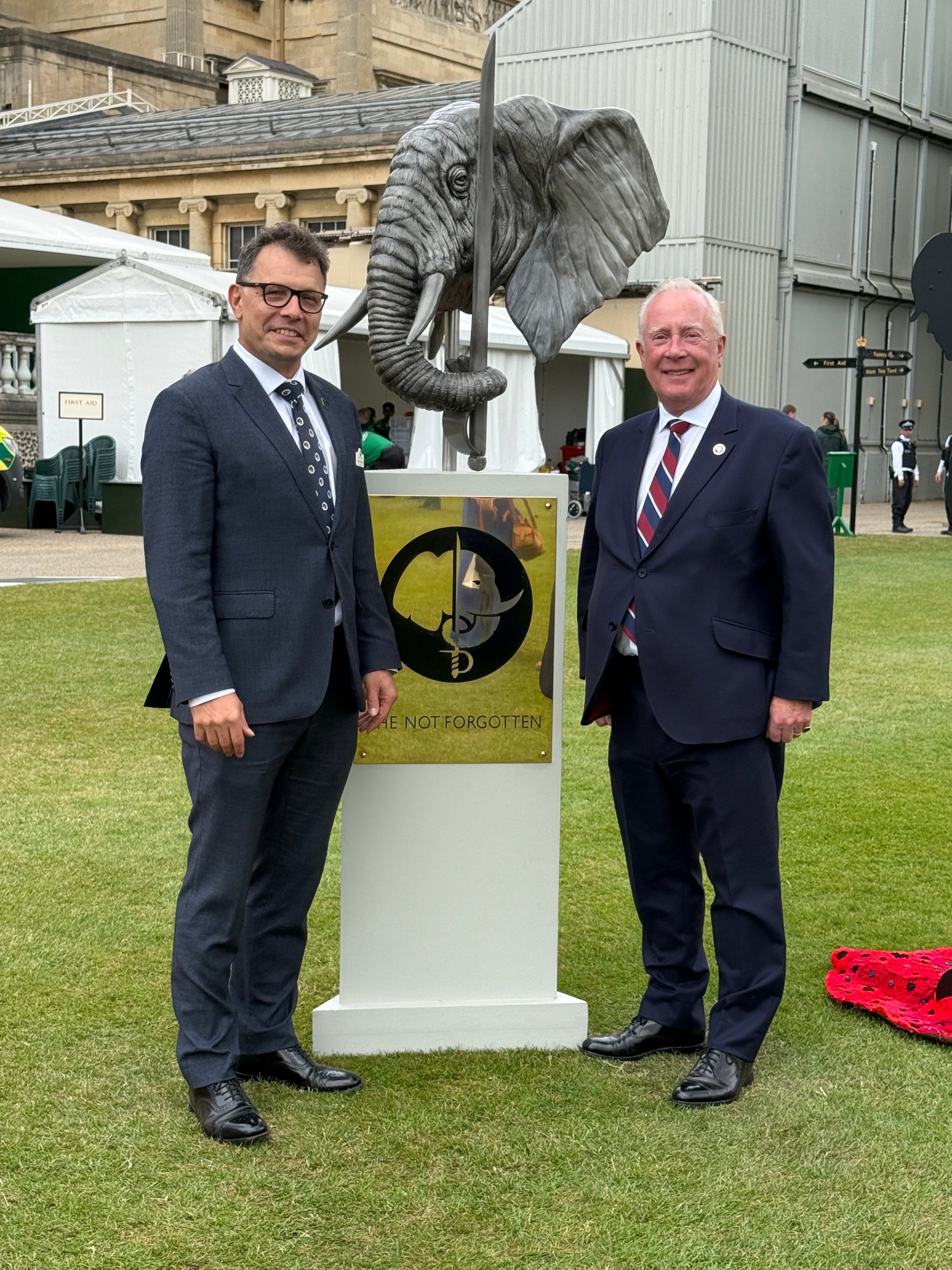 Peter Hewitt and Richard Walker OBE beside The Not Forgotten elephant statue at Buckingham Palace.