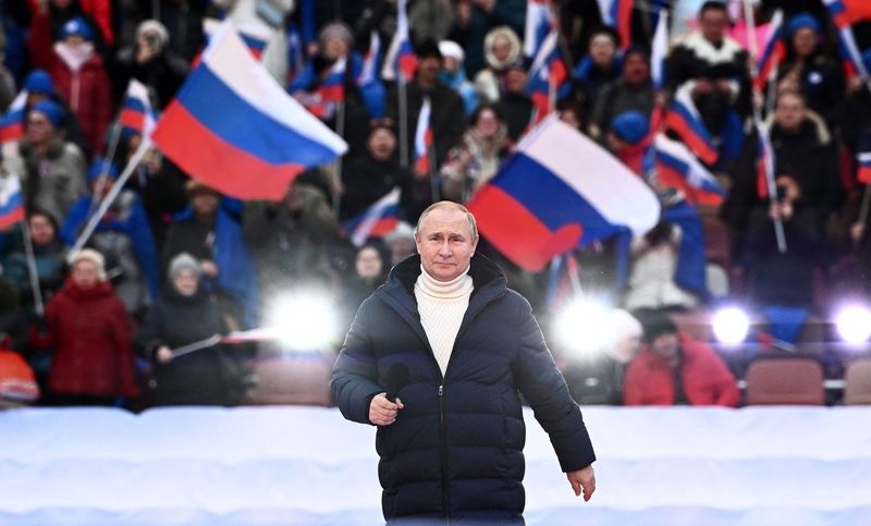 Vladimir Putin attends a concert marking the eighth anniversary of Russias annexation of Crimea, in Moscow, on March 18