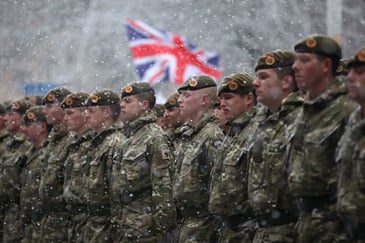 British soldiers march through the streets following a six-month tour of duty in Afghanistan on Dec. 1, 2010 in Blackburn, England. 
